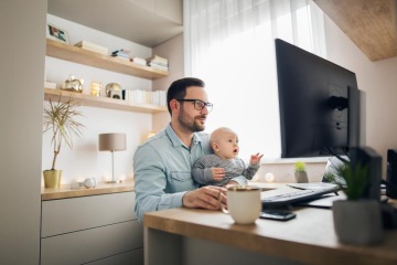 Man working with child at computer