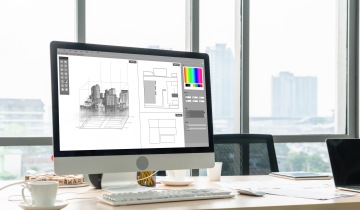 White computer monitor with a building model