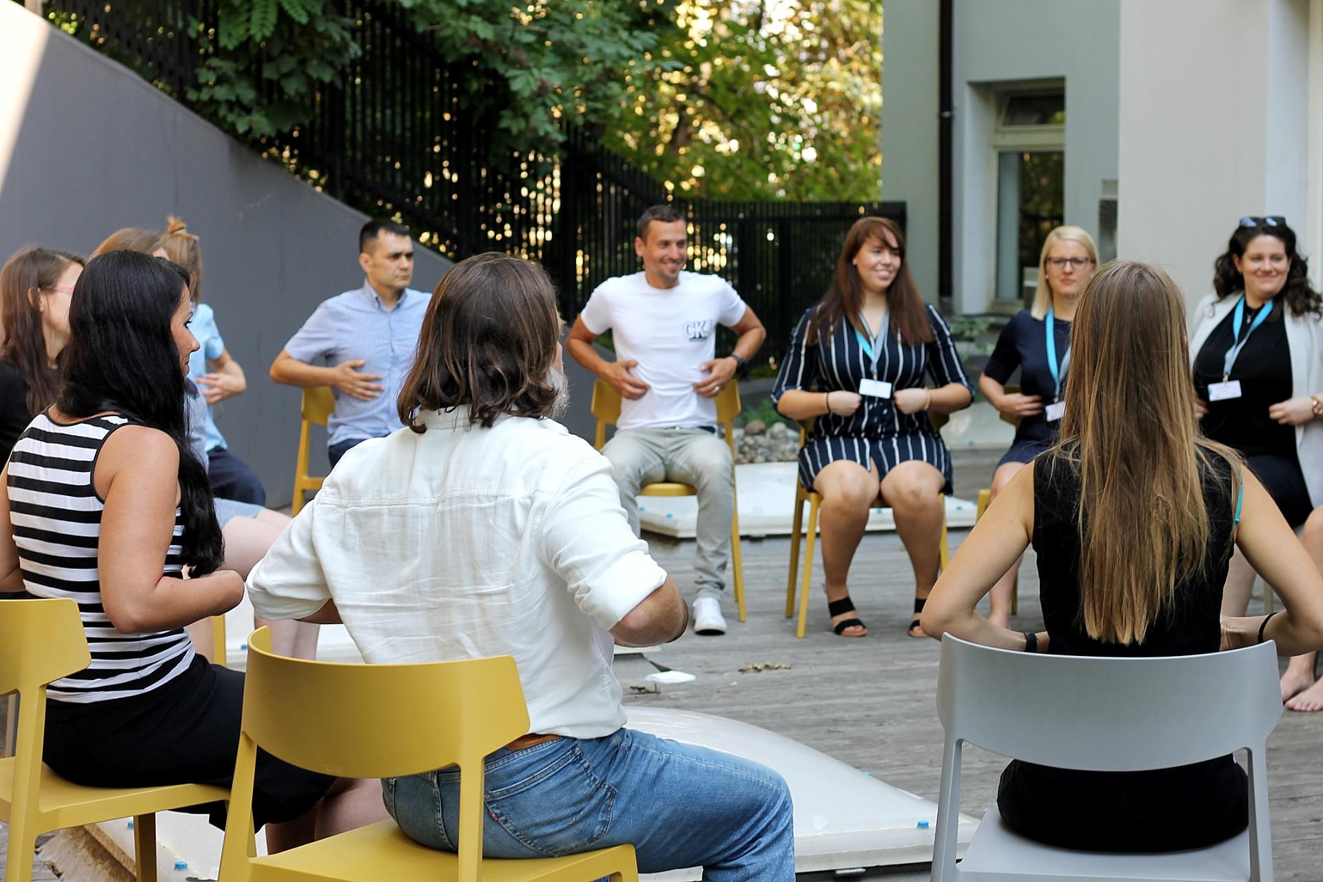 A team of employees sitting on the terrace
